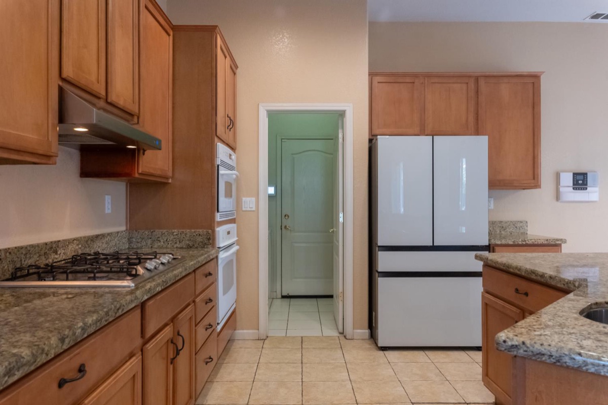 Kitchen with granite counters and gas cooktop